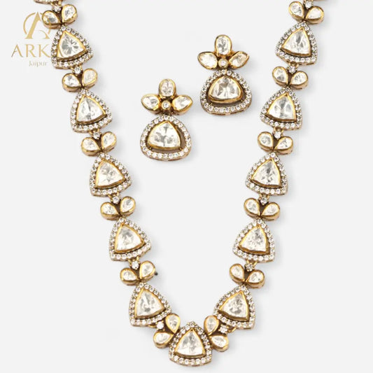 Petals of Paradise necklace and earring set by Arka Jaipur, featuring triangular kundan-style stones with zircon borders and gold petal accents in a handcrafted, traditional design.