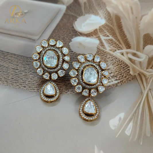 "Arka Jaipur handcrafted Polki Radiance earrings with central uncut diamond-look stones, halo design, teardrop drops, and gold finish – royal heritage jewelry."