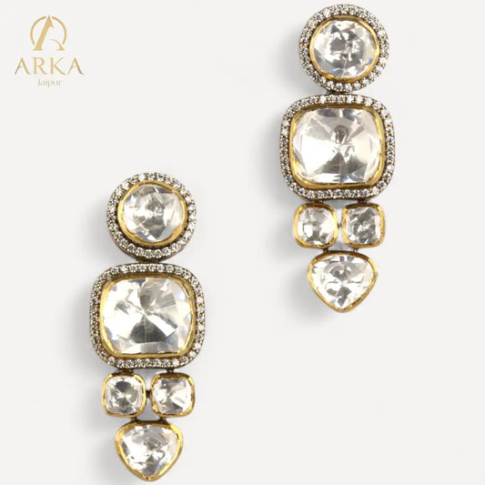 Elegantgold-plateddropearringswithpolki-styleuncutstonesandmoissaniteaccents_designedbyARKAJaipur_featuringamulti-stoneverticalarrangementonawhitebackground.