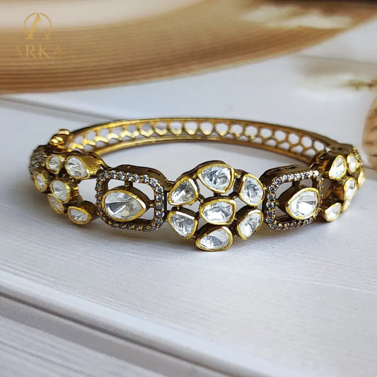 "Regal Polki Bloom Bangle ,Heritage polki floral gold-plated silver bangle with uncut stones by Arka Jaipur"