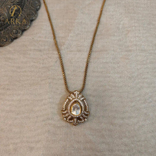 "Regal teardrop moissanite pendant in gold-plated silver by Arka Jaipur, heritage-inspired designer jewelry for weddings and festive occasions"
