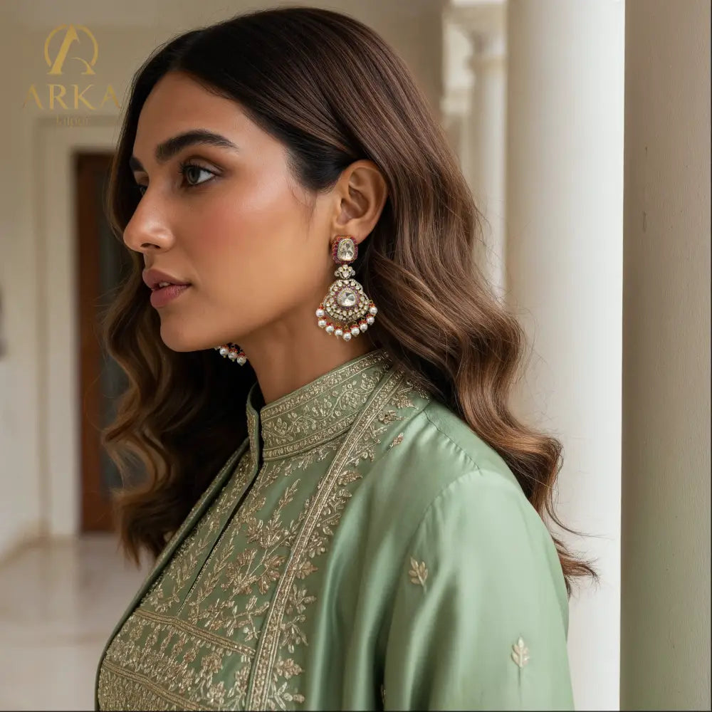 A woman wearing the Rosetta Royale Earrings with a traditional outfit