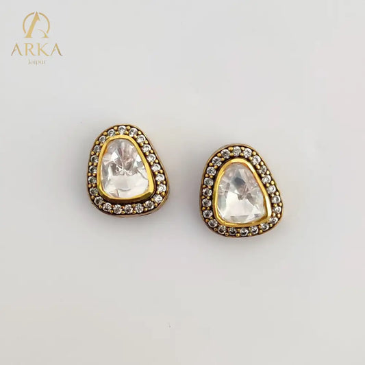 Twilight Triad studs by Arka Jaipur – asymmetrical triangle moissanite studs in silver with pavé halo setting.