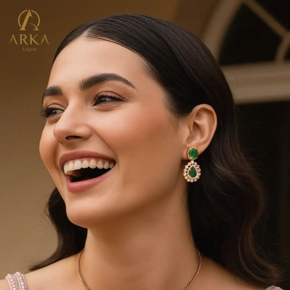 Arka Jaipur Vintage Emerald Charm handcrafted Pendant Set with carved emerald green stones, Polki diamond halo, and gold finish – heritage inspired statement jewelry.